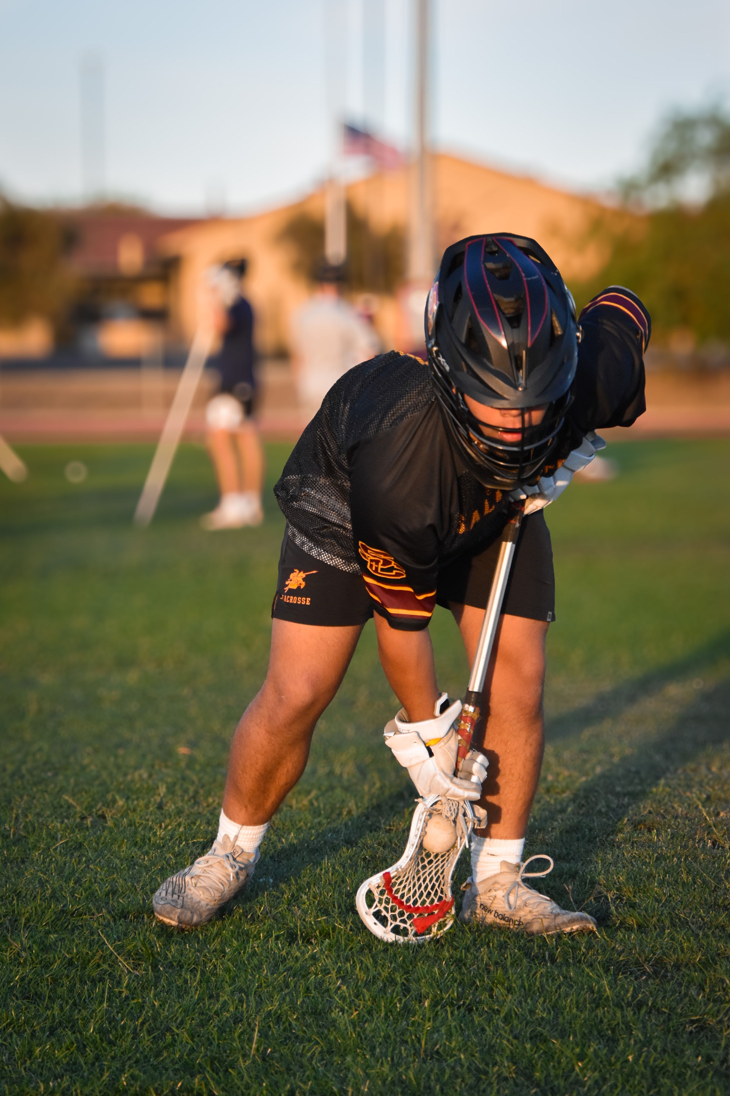 Lacrosse athlete on field